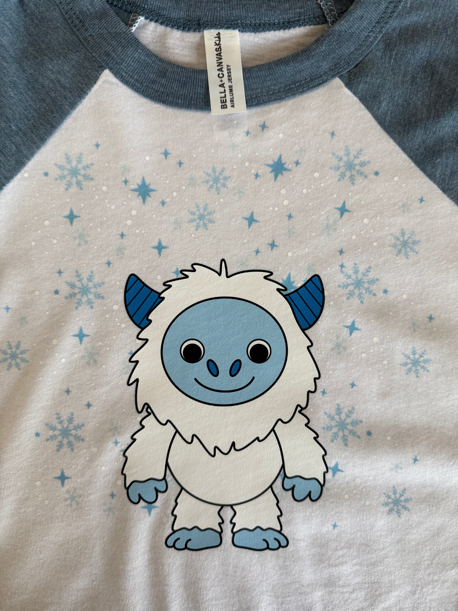 T-shirt with cartoon character and snowflake pattern